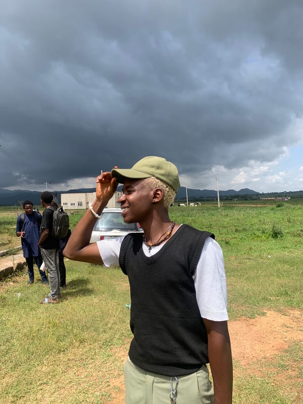 Casual group hangout in Gwafan, Nigeria on a cloudy afternoon