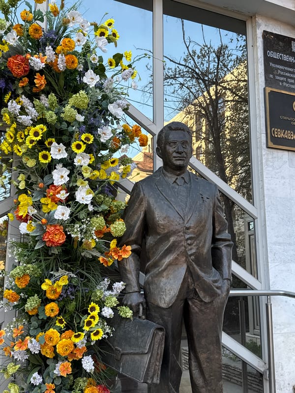 Bronze businessman statue with flowers displayed in Ovoshchnoy, Russia