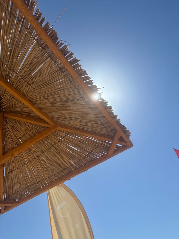 Relaxed beach club setup on a clear sunny morning