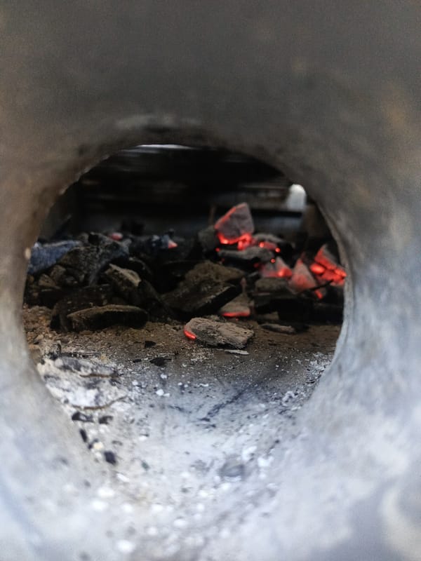 Evening cooking session with charcoal grill documented in Quevedo