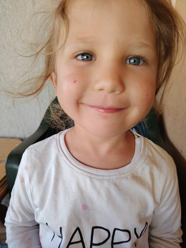 Child enjoys drink during morning moment in Bulgarian town