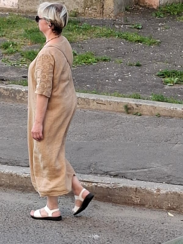 Everyday street life: pedestrians, parked cars, and sidewalk moments