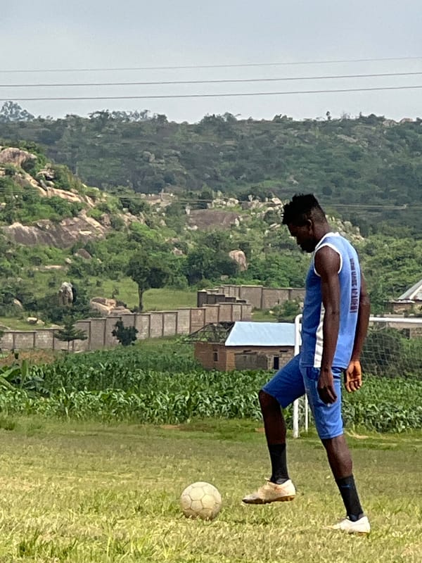 Soccer training session on a grassy field in Jos, Nigeria