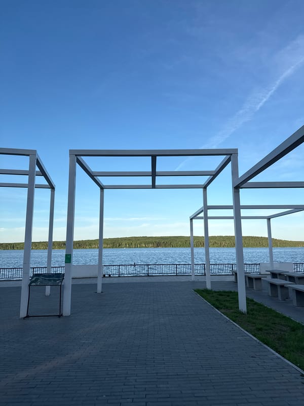 Afternoon at a lakeside park with games, water views, and open sky