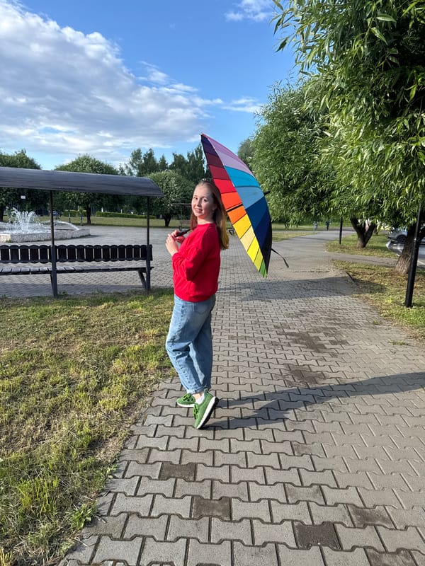 Rainy day out: makeup, pigeons, and a rainbow umbrella