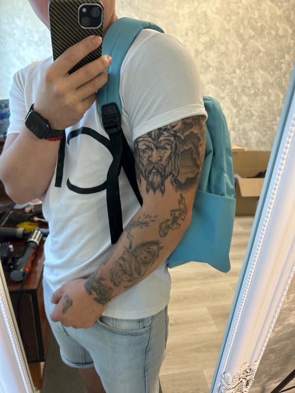 Mirror selfie in Kryvyi Rih, casual fit with visible tattoos