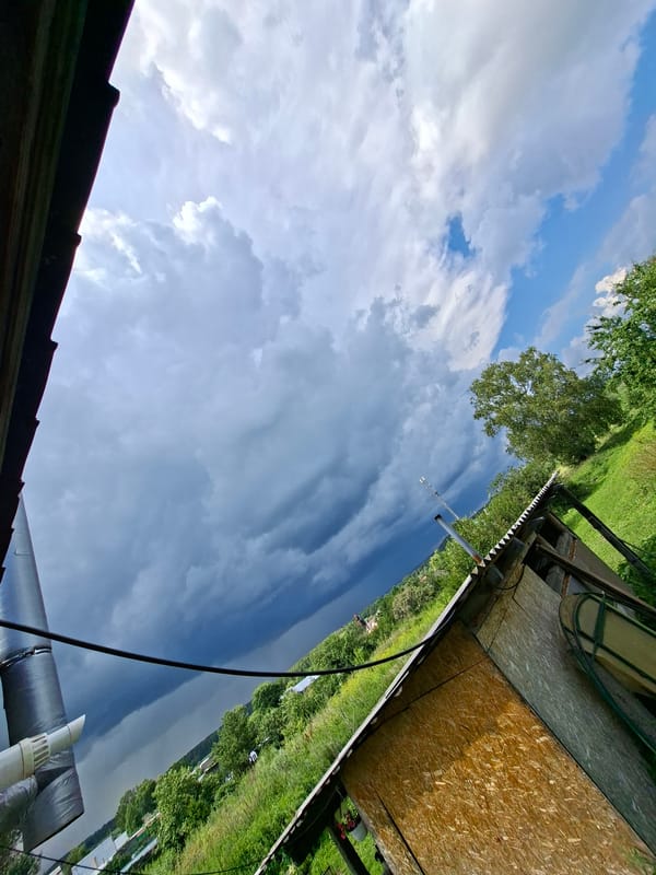 Storm clouds over Karsha fields, wildflowers, and a quiet morning indoors