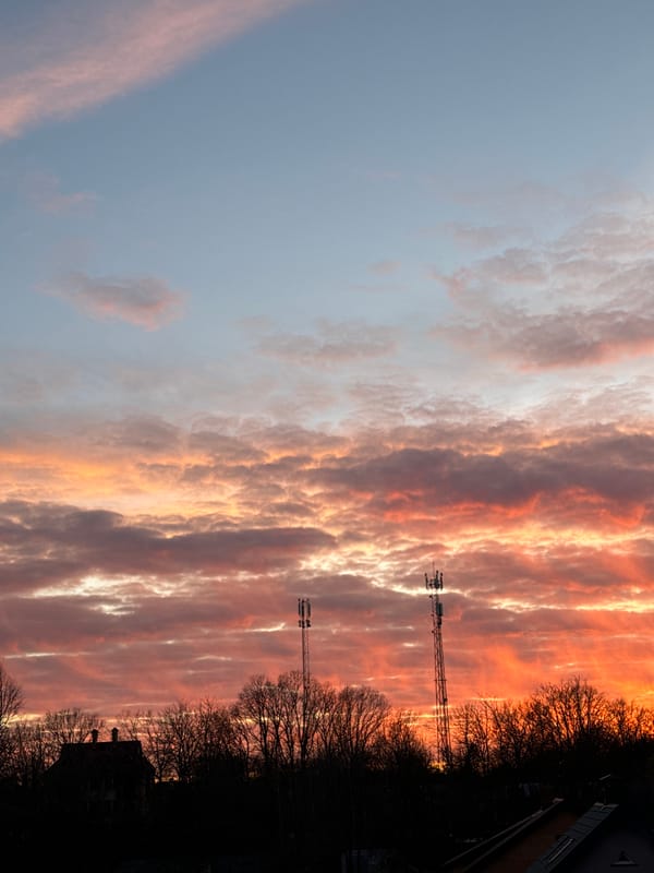 Dramatic sunset colors fill sky over Carnikava, Latvia