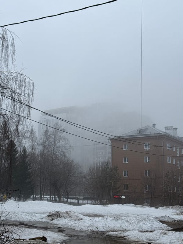 Fog blankets Kazan street, obscuring buildings