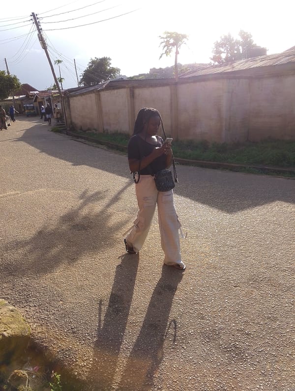 Afternoon street life along a Jos, Nigeria neighborhood