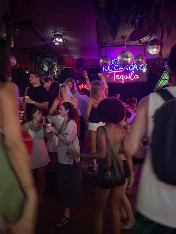 Tropical nightlife strip: bars, beach dining, and street scenes
