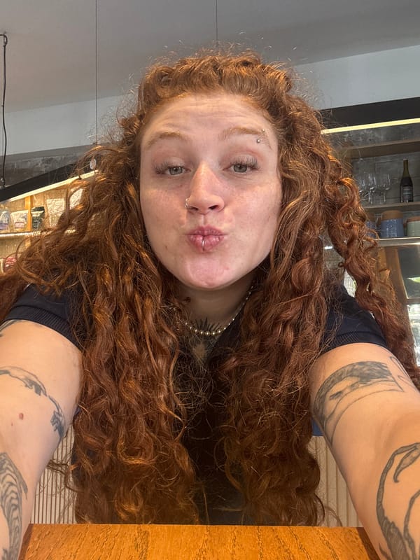 Woman documents restaurant meal with selfies in Buenos Aires