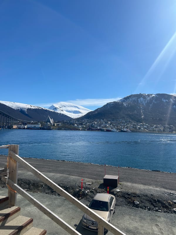 Clear skies frame Tromsø's fjord and snowy peaks