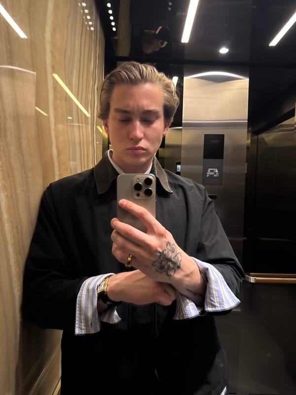 Young person takes selfie in upscale London building