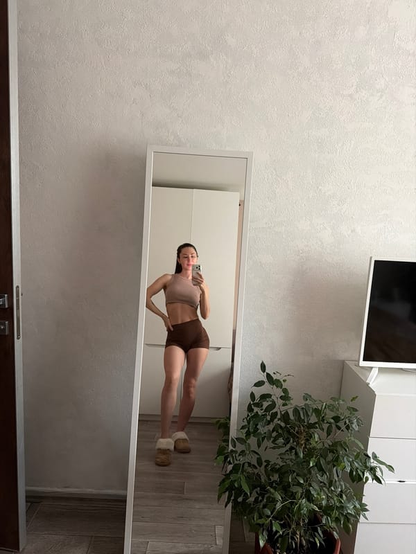 Woman photographed in bed during early morning hours in Perm