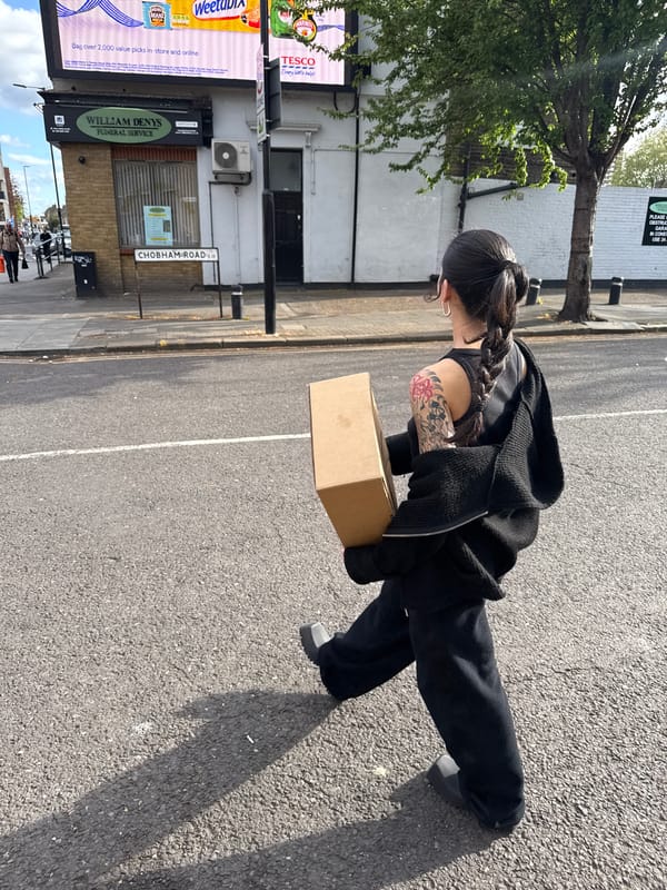 Woman with cardboard box spotted on London's Chobham Road