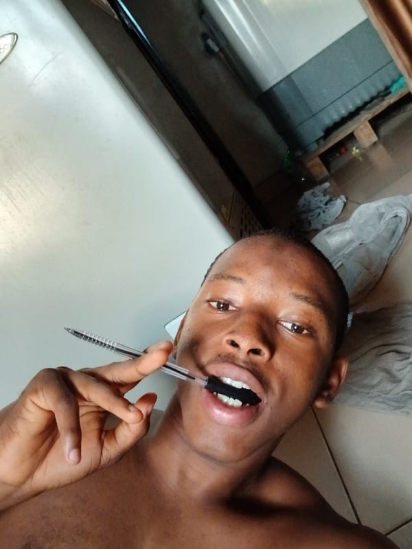 Man photographed in casual morning moments on bed in Lagos