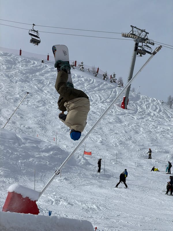 Skiers perform aerial tricks at Les Allues resort