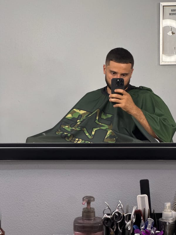Customer documents haircut experience at Patong barbershop with selfies