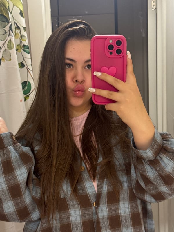 Woman takes bathroom selfies in Murino, Russia at dusk