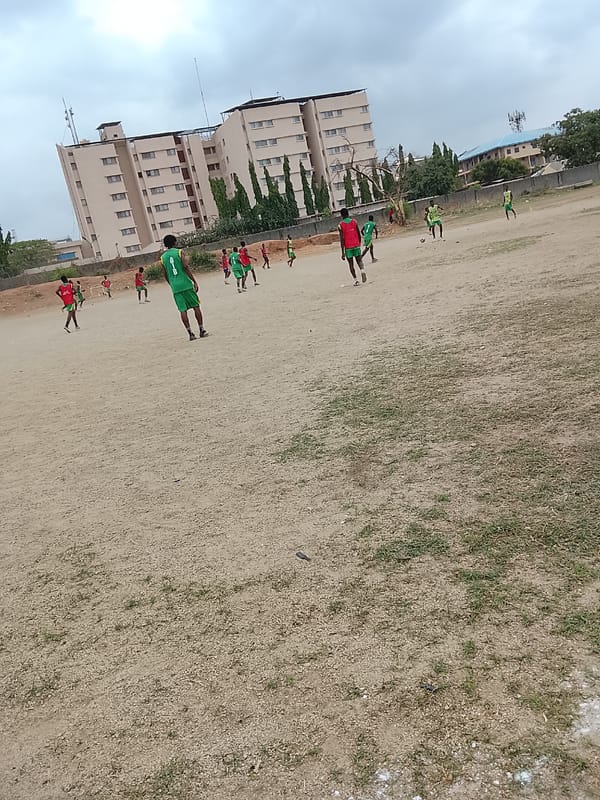 Soccer Match Played on Dirt Field in Abuja