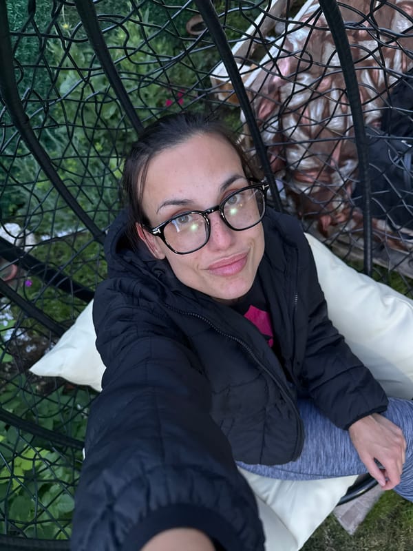 Woman enjoys quiet evening with dog in Pleven garden