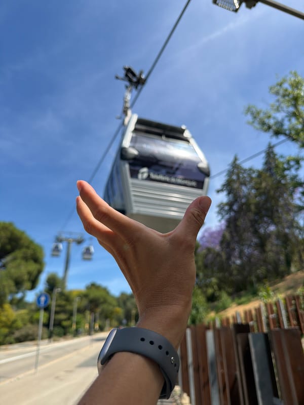 Tourist documents Barcelona cable car tour, city landmarks