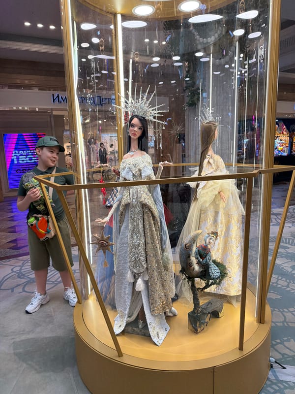 Boy explores puppet displays at Moscow's GUM department store