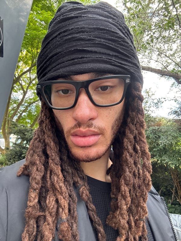 Person with dreadlocks photographed on Les Ulis street