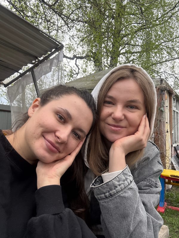 Two women take outdoor selfie together