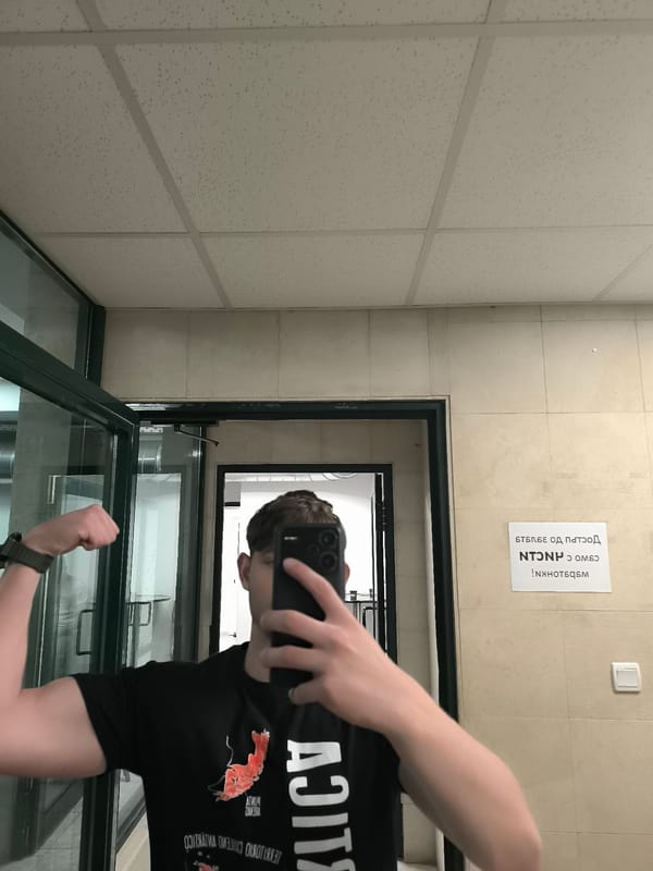 Person takes selfies while flexing indoors in Sofia