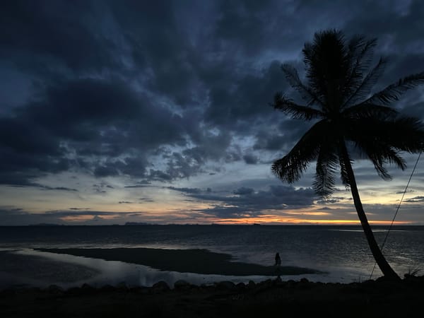 Lone figure photographed at dusk on Ko Phangan beach