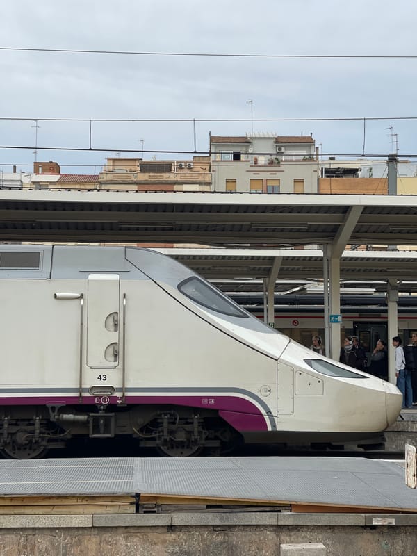 High-speed train passengers board at València station