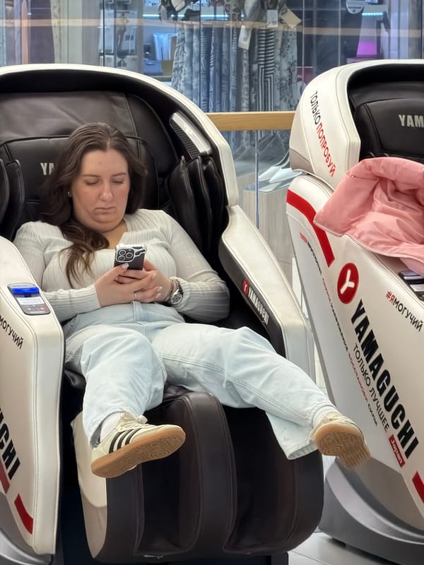 Woman tests Yamaguchi massage chair at Moscow store