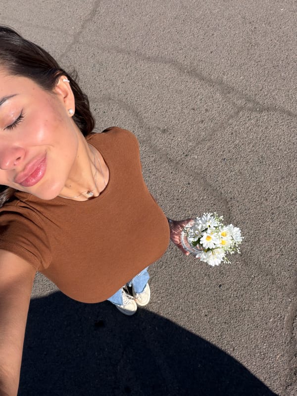 Woman photographed reclining on pavement in Krasnoyarsk sunlight