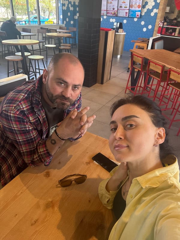 Couple takes selfies during breakfast at Tbilisi pizza restaurant