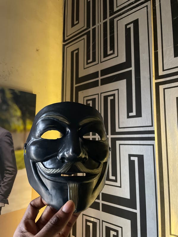 Person photographs themselves wearing black mask in Lokoja, Nigeria