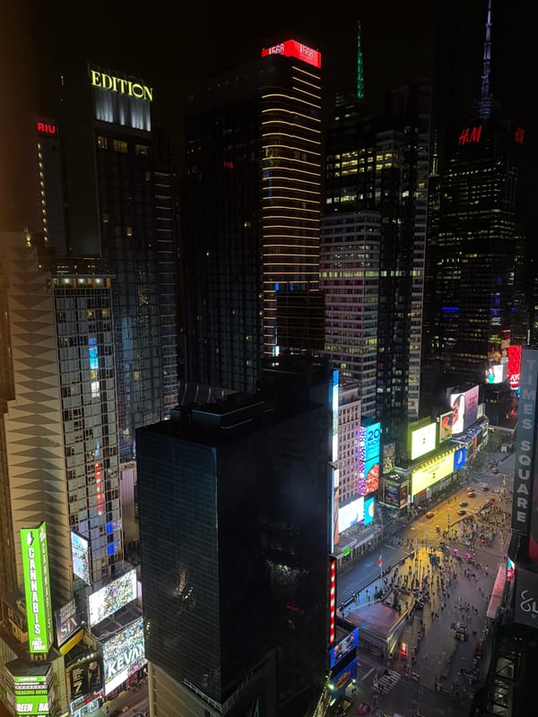 Aerial view captures nighttime Times Square scene early morning