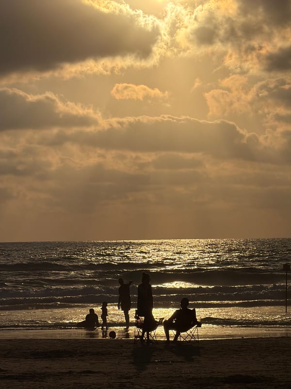 Late afternoon at the Bat Yam shoreline, golden hour winding down.