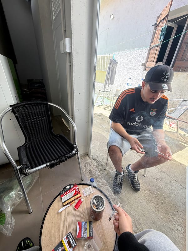 Two people smoking outdoors in Vila Real, Portugal