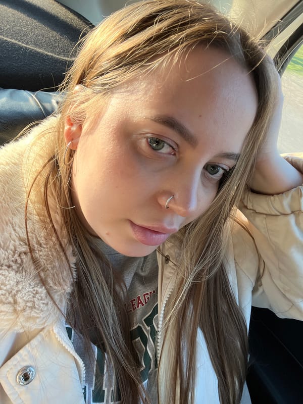 Woman takes selfie in car in Novopokrovskaya, Russia