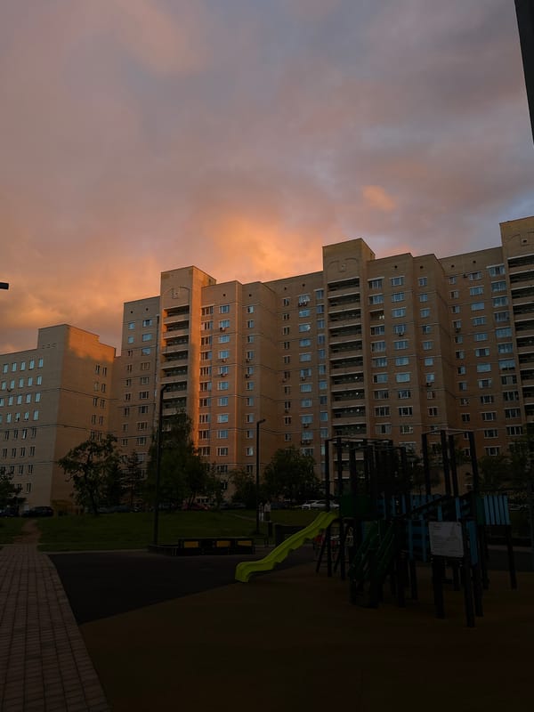 Evening documentation of modern Minsk buildings and rainbow at dusk