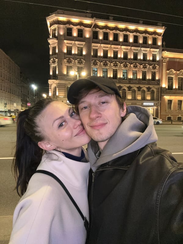 Nighttime scenes captured in Saint Petersburg include couple selfie, architecture