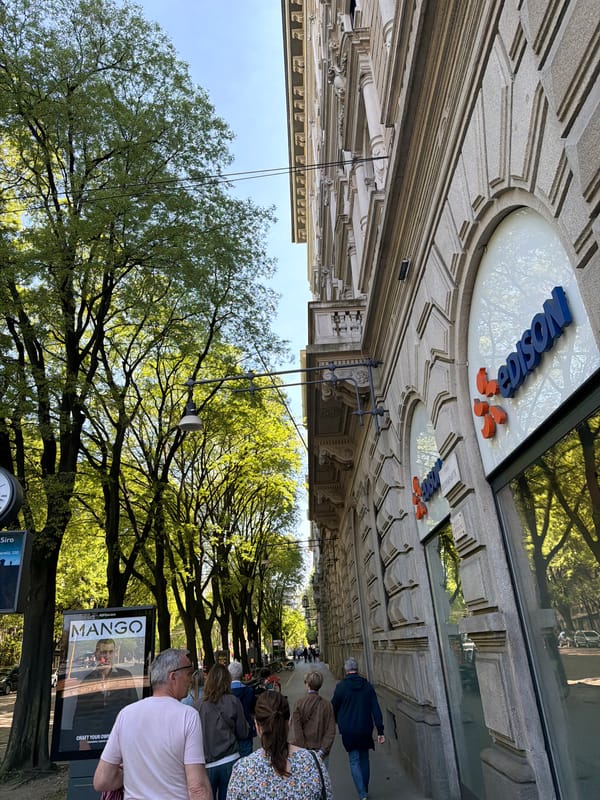 Tourist captures Milan landmarks during afternoon walking tour