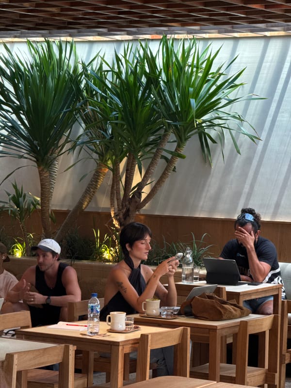 Man works on laptop at North Kuta cafe