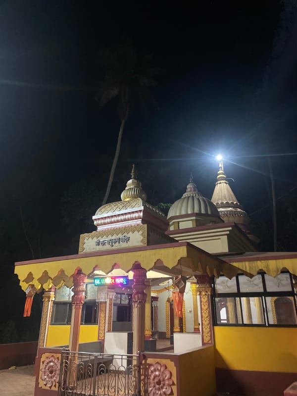 Hindu temple illuminated at night in Redi, India