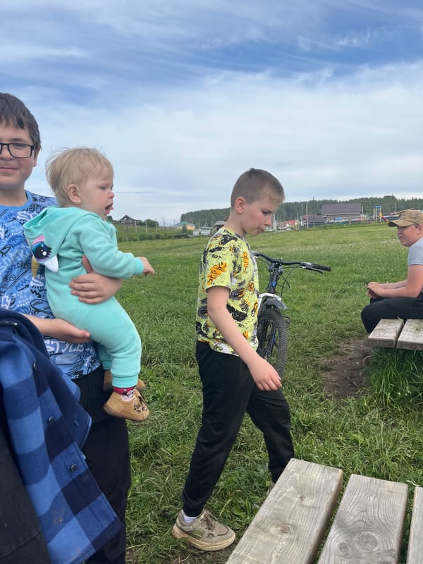 Family outing documented by lake in rural Russia