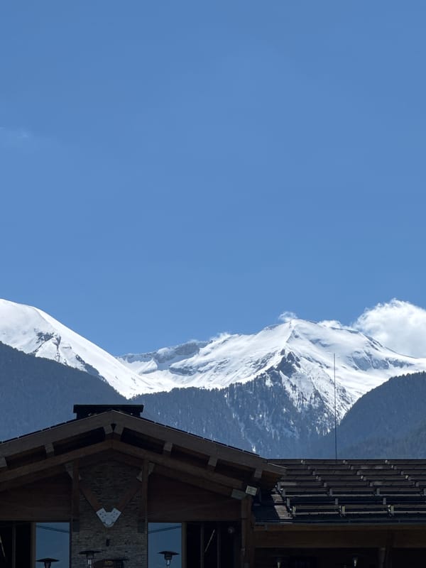 Snow-covered mountains observed in Razlog, Bulgaria under clear skies