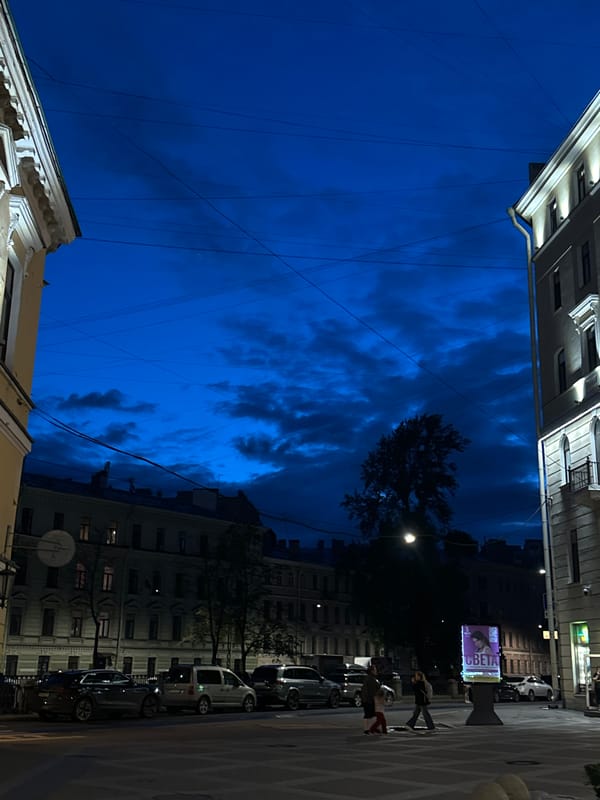 Evening stroll captures illuminated historic buildings in European city