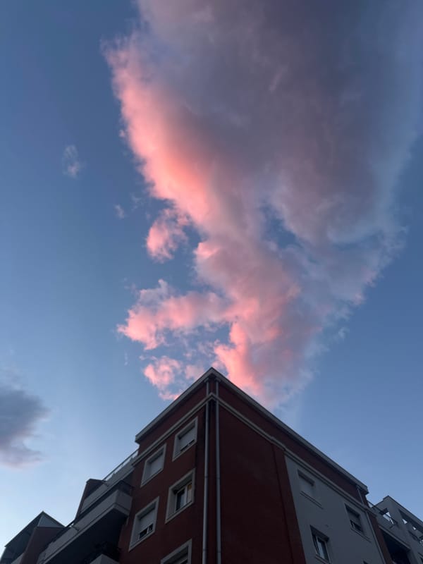 Dramatic pink sunset clouds captured over Budva, Montenegro